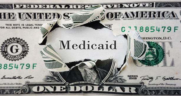 Image of dollar bill and Medicaid